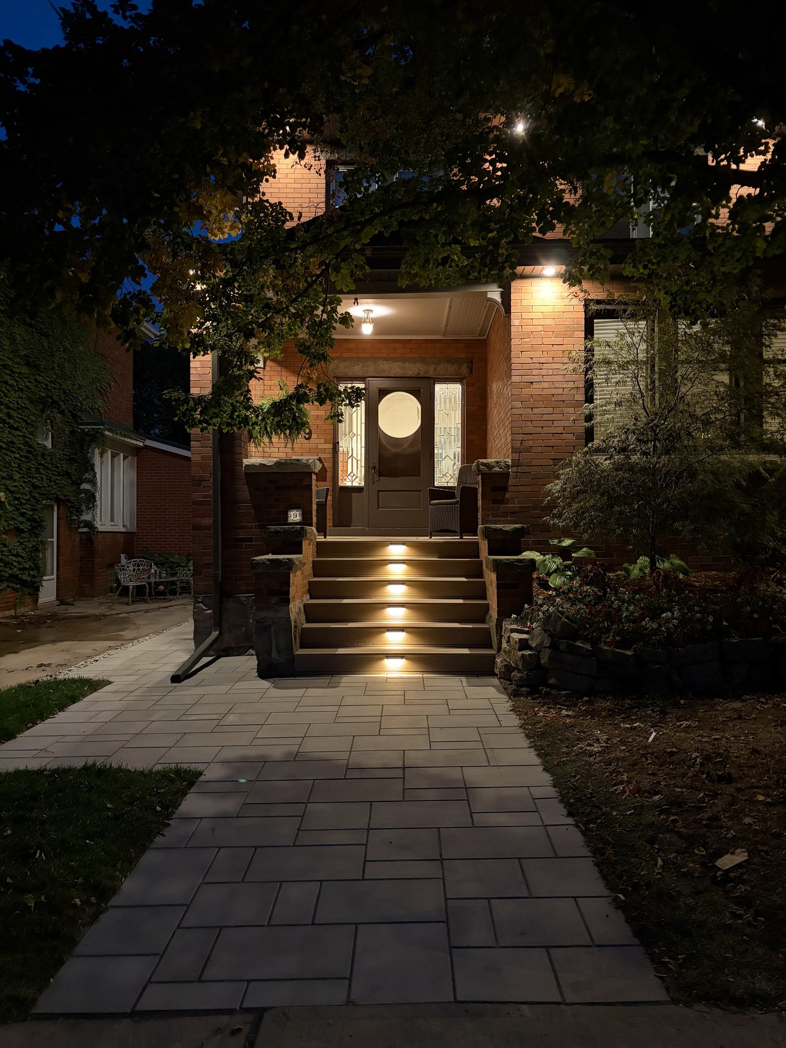 A thoughtful front porch update for one of Hamilton’s unique character homes.
We rebuilt the porch in composite deck boards, releveled it, and introduced deeper stair treads for a safer, more comfortable climb. Integrated stair lighting with Wi-Fi control adds another layer of function and makes the entrance feel just as considered after dark.
Paired with the new walkway, the whole front entry now feels cleaner, more welcoming, and much better connected to the home.
Amazing design by @coachhouse_gardenstudio
#HamiltonHomes #HamiltonLandscaping #LandscapeDesign